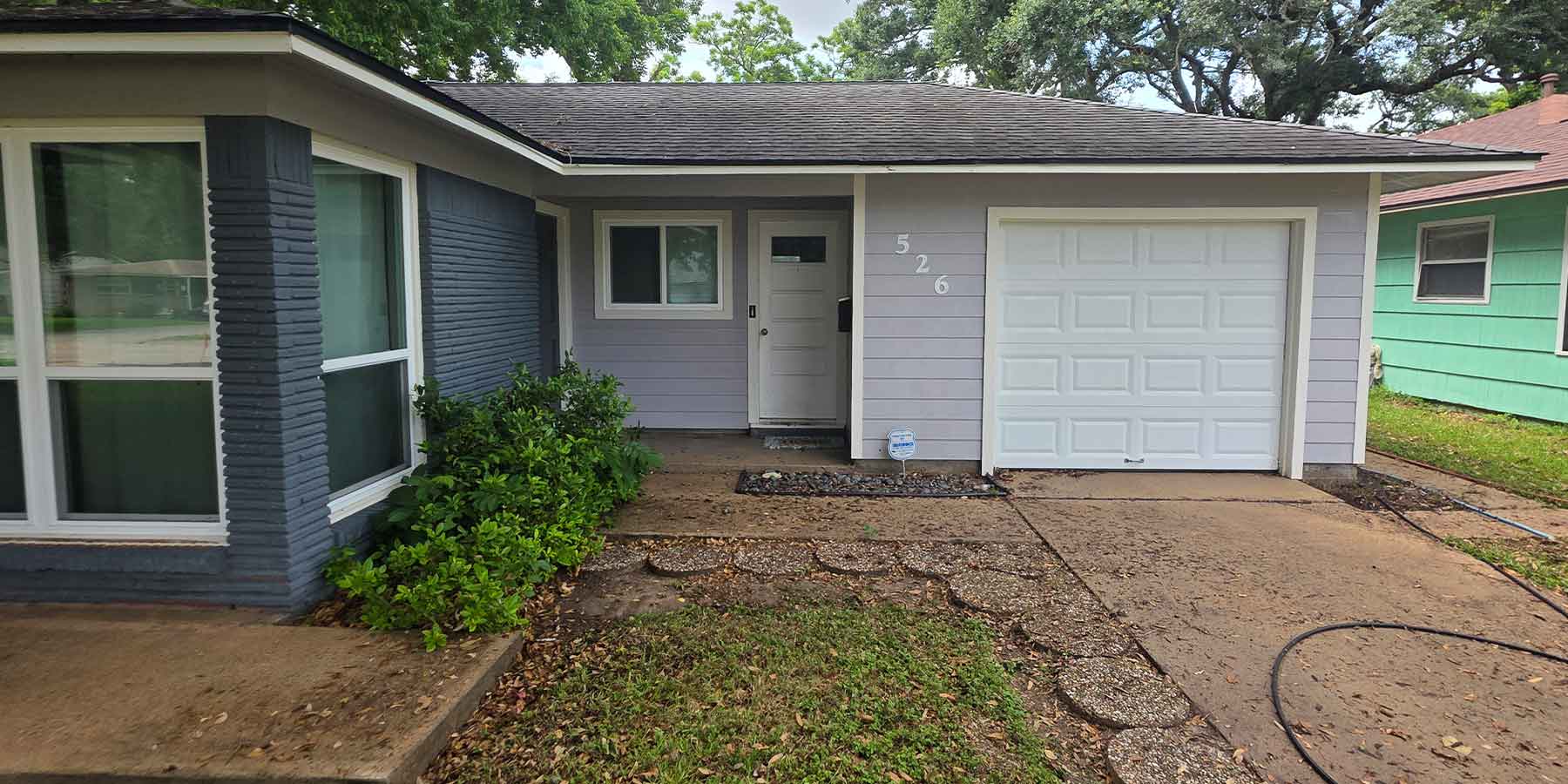 Clean white gutters and fascia on a freshly washed home