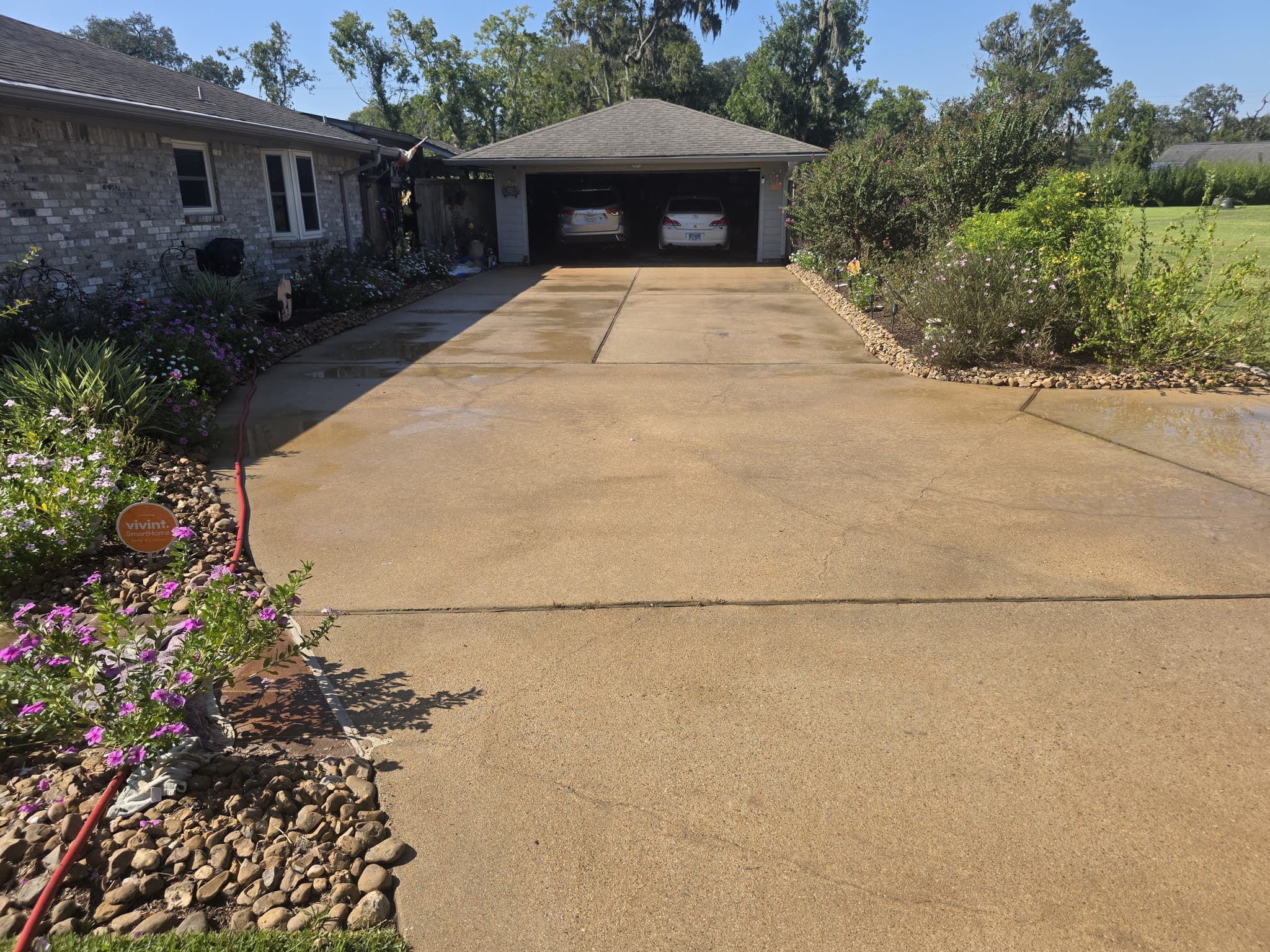 After: A concrete driveway before and after surface cleaning