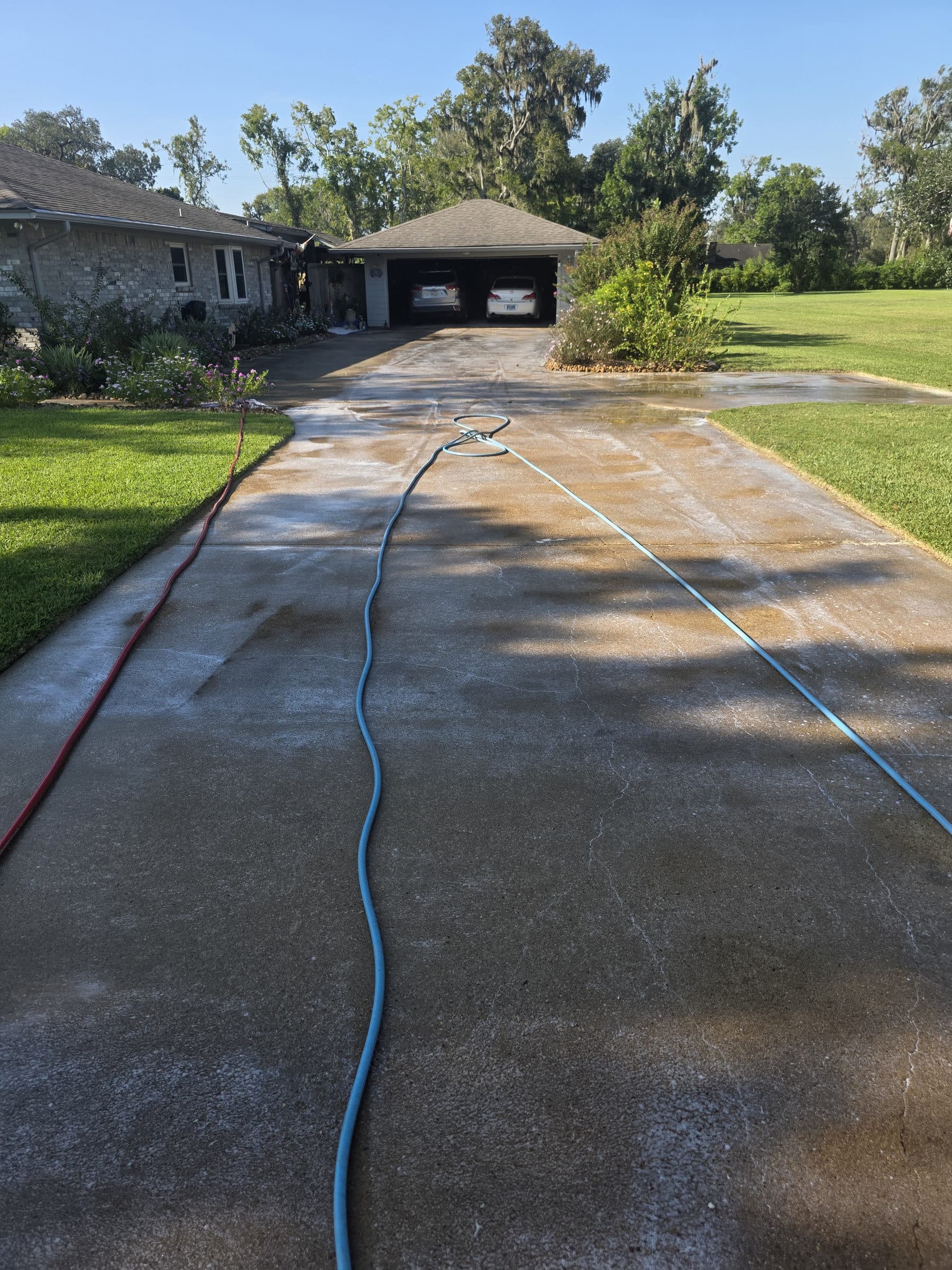 Before: A concrete driveway before and after surface cleaning