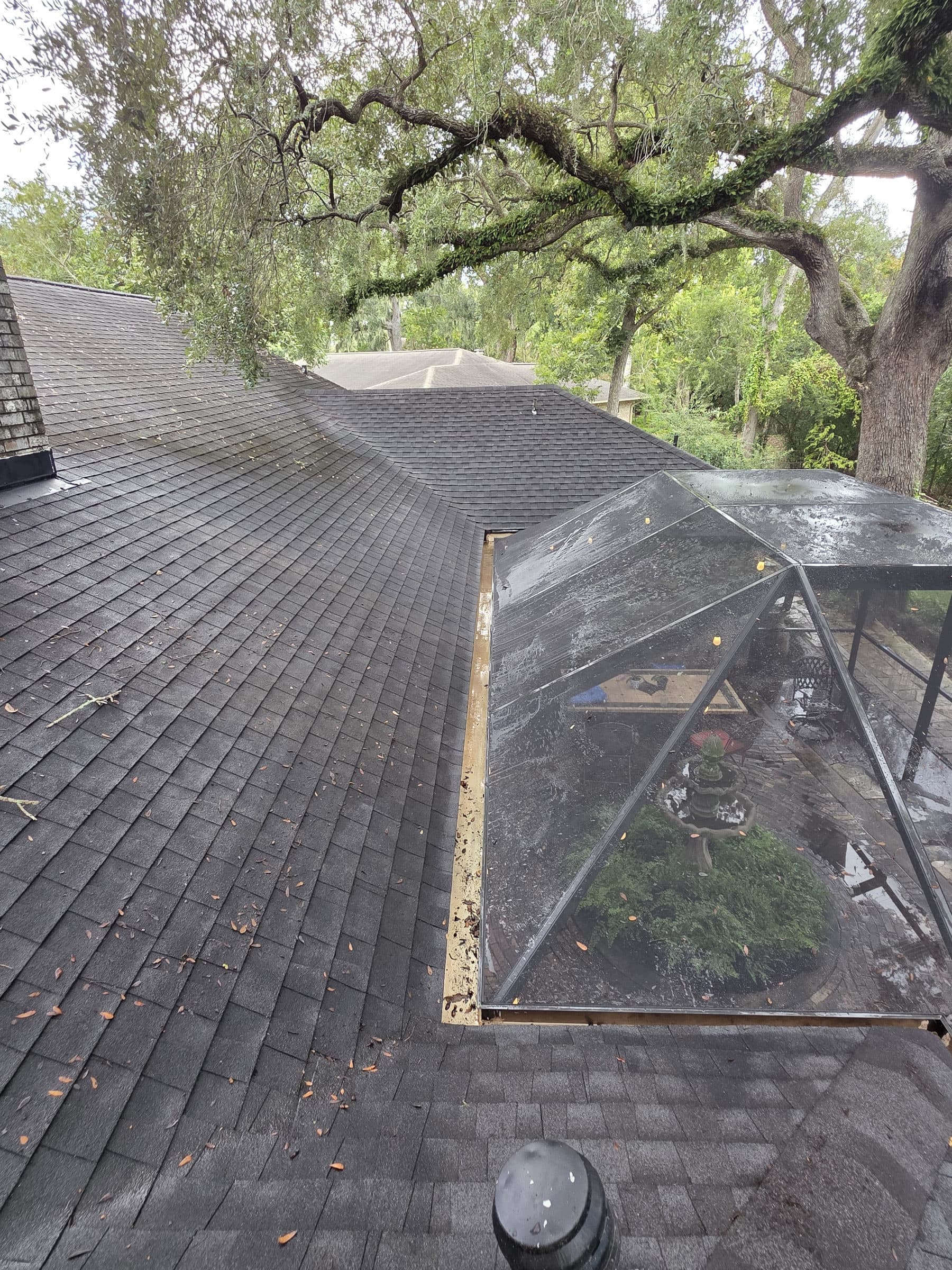 After: A gutter run before and after cleaning and brightening, with the black tiger stripes removed